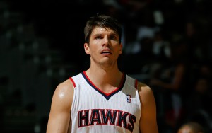 ATLANTA, GA - DECEMBER 06:  Kyle Korver #26 of the Atlanta Hawks walks back on the court against the Cleveland Cavaliers after setting an NBA record by making a 3-pointer in his 90th straight game at Philips Arena on December 6, 2013 in Atlanta, Georgia.  NOTE TO USER: User expressly acknowledges and agrees that, by downloading and or using this photograph, User is consenting to the terms and conditions of the Getty Images License Agreement.  (Photo by Kevin C. Cox/Getty Images)