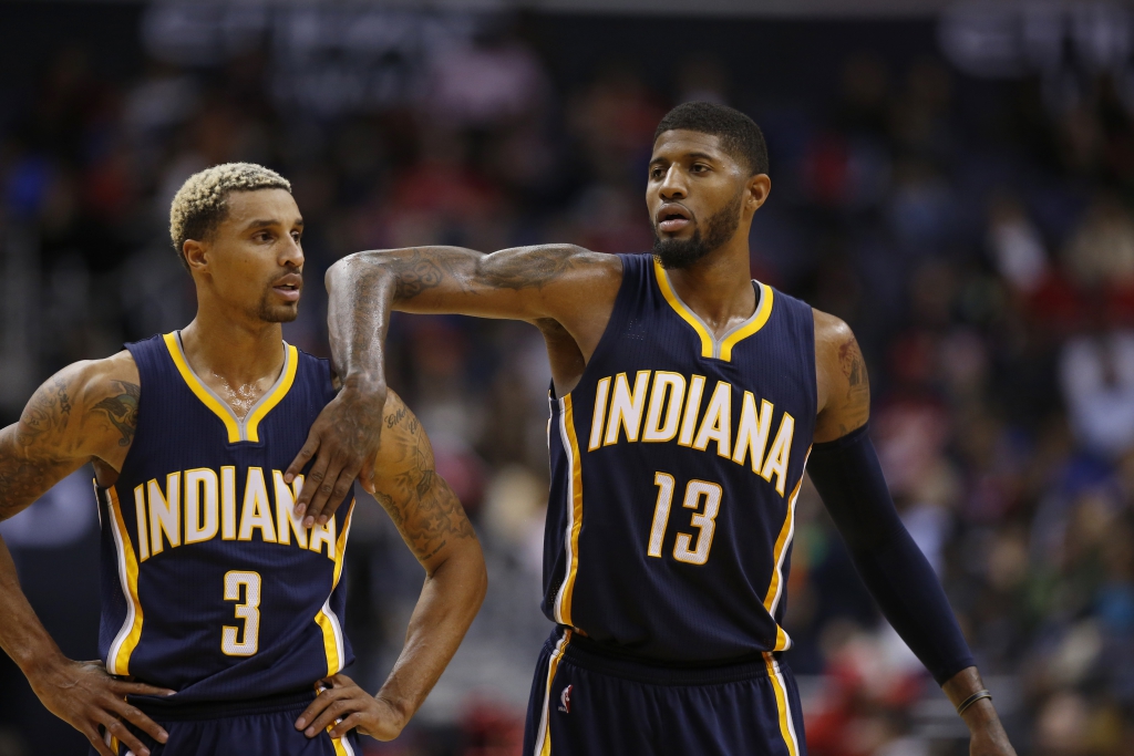 Indiana Pacers guard George Hill (3) and Indiana Pacers forward Paul George (13) react in the second half of an NBA basketball game against the Washington Wizards, Tuesday, Nov. 24, 2015, in Washington. The Pacers won 123-106. (AP Photo/Alex Brandon)