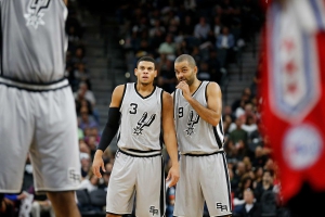 Spurs' Tony Parker (09) offers guidance to teammate Ray McCallum (03) during the game against the Philadelphia 76ers at the AT&T Center on Saturday, Nov. 14, 2015. (Kin Man Hui/San Antonio Express-News)