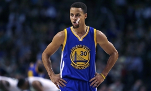 Golden State Warriors guard Stephen Curry (30) waits for play to resume during the first quarter of an NBA basketball game against the Boston Celtics in Boston, Friday, Dec. 11, 2015. (AP Photo/Charles Krupa)